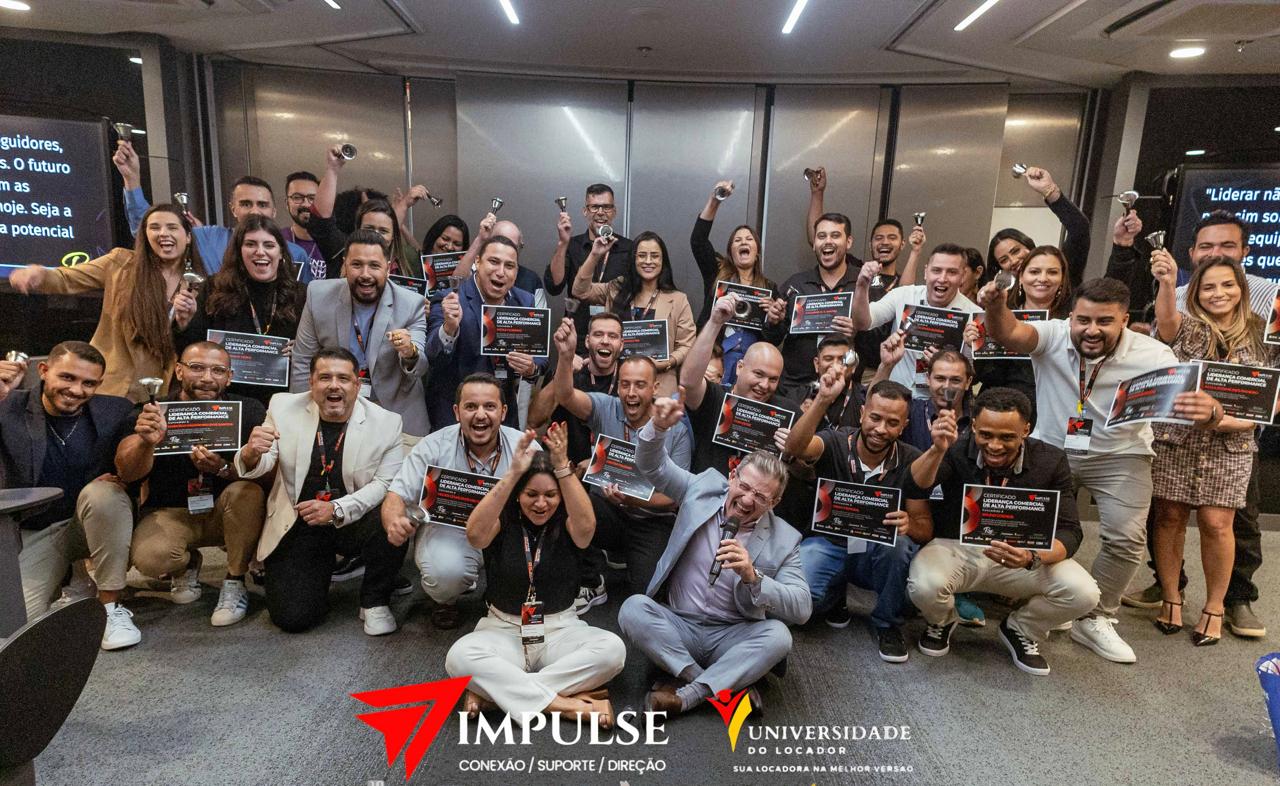 Plateia atenta em evento empresarial premium do IMPULSE Masterclass